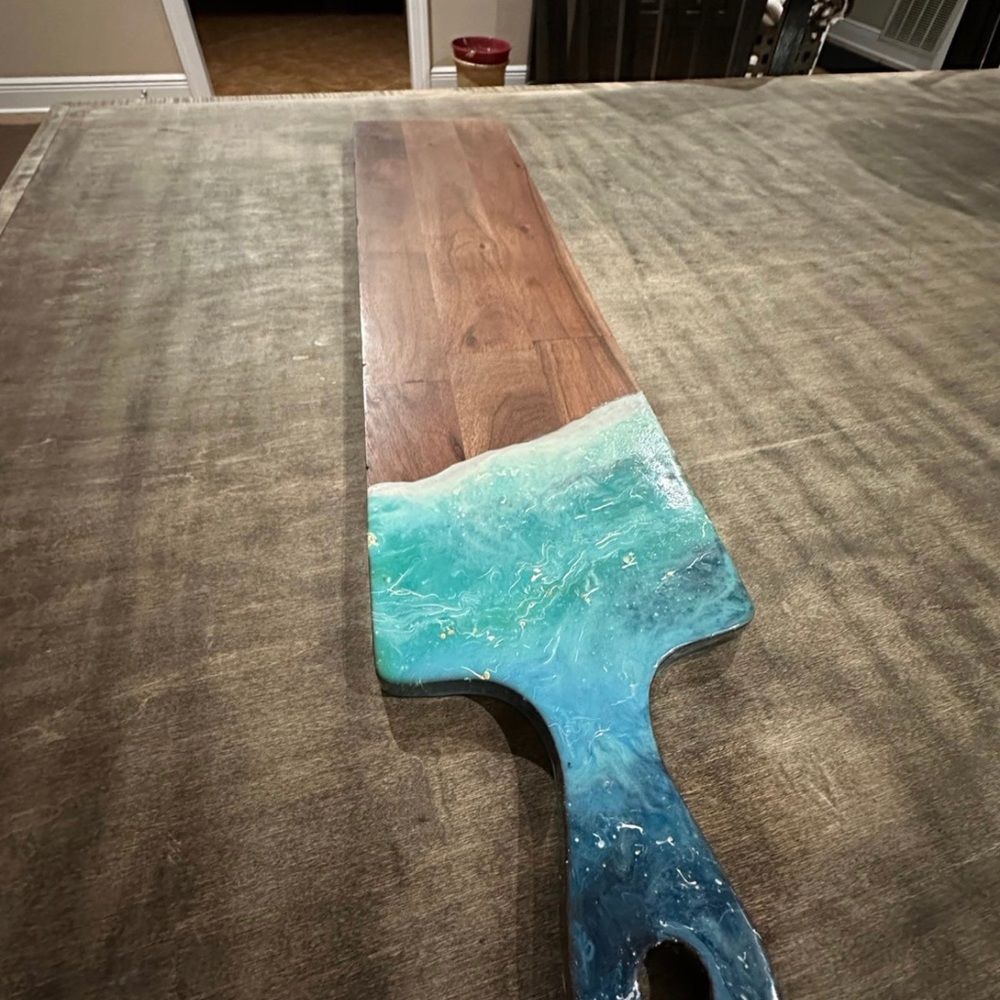 Hand poured resin board. Inspired by a washed up beach wave. Food safe resin.